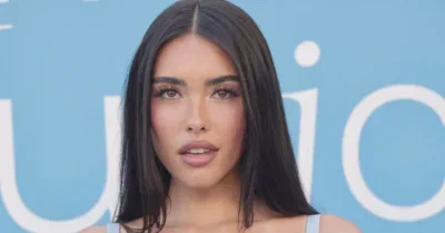 Madison Beer Sports Chic Glasses and Black Top While Celebrating